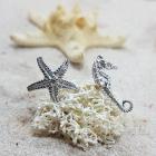 Orecchini cavalluccio e stella in oro con diamante